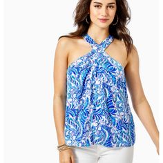 An Easy-Fit, Lined Style, Our Rori Halter Top Is Comfy And Chic. Pleated Neckline Details, An Elastic Back Neck, And Tie-Back Neckline Give A New Twist To The Classic Sleeveless Tank. A Colorfully Bright Lilly Print Ties This Whole Relaxed Look Together. Easy Fit, Lined Halter Top With Pleated Neckline Details, Elastic Back And A Tie-Back Neckline. Island Satin (100% Polyester). Machine Wash Cold, Separately. Chic Blue Halter Neck Top, Chic Blue Top For Vacation, Blue Halter Neck Top For Vacation, Blue Stretch Tops For Vacation, Blue Halter Neck Summer Top, Blue Printed Halter Neck Top, Blue Printed Summer Tops, Blue Summer Printed Tops, Long Sleeve Smock Dress