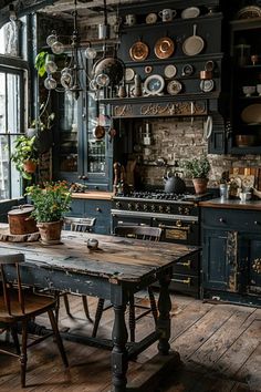 an old fashioned kitchen with lots of pots and pans hanging from the wall above the table