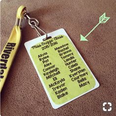 a keychain with a name tag attached to it and an arrow next to it