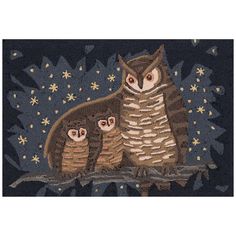 an owl and her two babies are sitting on a tree branch in the night sky