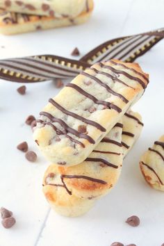 chocolate drizzled on top of some cookies