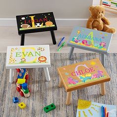 several children's toys are sitting on the floor in front of a chalkboard