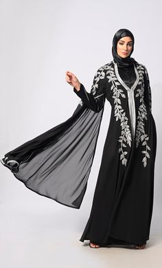 Introducing our latest marvel from the Eid Collection: the epitome of elegance and craftsmanship, our Handwork Abaya. Crafted with meticulous attention to detail, this abaya is a fusion of tradition and contemporary sophistication. Featuring intricate handwork adorning the entire garment, each stitch is a testament to the skill and dedication of our artisans. From delicate katdana embellishments to shimmering stone work, every detail is thoughtfully placed to create a stunning visual masterpiece. Designed for both style and comfort, our Handwork Abaya boasts luxurious satin lining that drapes gracefully against your skin. The batwing sleeves add a touch of drama and flair, while providing ample room for movement and ease of wear. Embrace the spirit of the season with our Eid Collection Aba Black Abaya, Eid Collection, Latest African Fashion Dresses, Stone Work, African Fashion Dresses, Batwing Sleeve, Bat Wings, African Fashion, Fashion Dresses