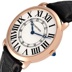 Cartier Ronde Louis Rose Gold Silver Dial Mens Watch W6801004. Manual winding movement. 18k rose gold case 42.0 mm in diameter. Circular grained crown set with the blue sapphire cabochon. . Scratch resistant sapphire crystal. Silvered grained dial. Painted black roman numerals. Apple shaped blued steel hands. Secret cartier signature at VII. Black leather strap with the 18K rose gold tang buckle. Classic Cartier Watch, Formal Cartier Watch With Round Dial, Formal Cartier Watch, Cartier Timeless Watch With Skeleton Dial, Cartier Timeless Watch Accessories With Skeleton Dial, Classic Rose Gold Watch, Cartier Timeless Round Watch, Timeless Cartier Round Watch, Timeless Round Cartier Watch