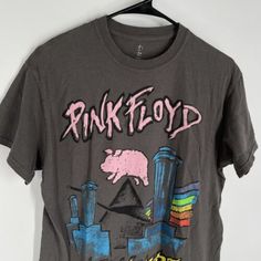 a t - shirt that says pink floyd on the front, and an image of a pig