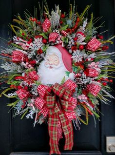 a christmas wreath with santa claus on it