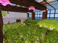 the inside of a house with lots of plants and flowers in front of large windows