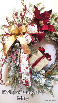 a christmas wreath with red and gold decorations