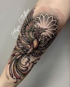 an arm with a bird on it and flowers in the middle, as well as words above