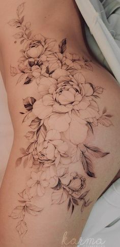 a woman's stomach with flowers on it