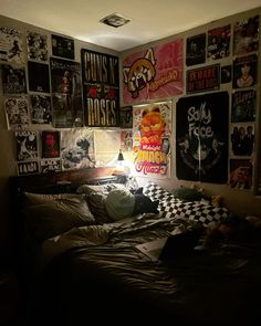 a bed with lots of posters on the wall