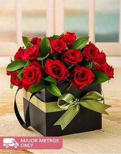 a black box with red roses in it