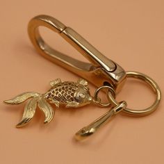 Please note: Colors may vary on different computer monitors and in different lighting conditions. Material : Brass Color: As picture Size : ring dia. 30mm Clap length 40mm The fish size is about 18×33mm. Quantity: 1 pcs More choice please go to: https://www.etsy.com/shop/WThouse?ref=seller-platform-mcnav Any other requirments please contact with me. Gold Rectangular Keychain For Personal Use, Metal Keychain With Key Leash For Gift, Gold Rectangular Keychain With Key Leash, Gold Metal Keychain For Gift, Gold Metal Keychain Perfect For Gifts, Fish Pendant, Chain Purse, Funky Jewelry, Wallet Chain