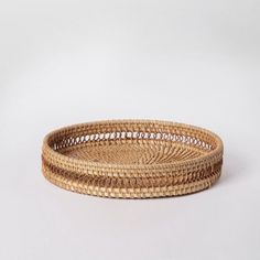 a woven basket is shown on a white surface