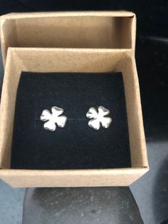 These tiny .925 solid sterling four leaf clover stud earrings are petite and just so cute. Great gift for one who prefers minimal jewelry. 🍀 They measure approximately 8.6mm, are soldered, tumbled and finished with sterling silver butterfly backs. The photos are enlarged to show all the details. ~~ All jewelry from The Black Lotus Jewelry Co. will arrive securely packaged in a gift box with a lovely ribbon. Perfect for gift giving or a wonderful treat for yourself! Thank you for supporting my l Tiny Sterling Silver Flower Earrings, Tiny Sterling Silver Flower Earrings As Gift, Nickel-free White Gold Flower Earrings As Gift, Classic Silver Flower Earrings For Gift, St Patricks Day Earrings, Lotus Jewelry, Clover Earrings, Earrings Dainty, Minimal Jewelry