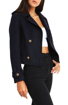 Stay warm and look chic in this felted wool blend peacoat featuring a cute cropped silhouette with a double-breasted closure for elevated style. 20.87" length (size S) Notch lapel Long sleeves with button tab cuffs Double-breasted closure Shoulder epaulets Felted construction Welt pockets Pocket seam sewn shut and must be seam ripped to open Cropped 60% wool, 40% polyester Dry clean Imported Model’s stats for sizing: 5’11” height, 32” bust, 25” waist, 35” hips. Model is wearing size S. Cropped Outerwear With Buttons For Fall, Chic Cropped Jacket With Buttons For Fall, Chic Fall Cropped Jacket With Buttons, Cropped Fall Outerwear With Buttons, Fall Cropped Outerwear With Buttons, Winter Cropped Jacket With Button Closure, Fitted Double-breasted Trendy Cropped Jacket, Trendy Fitted Double-breasted Pea Coat, Fitted Double-breasted Cropped Jacket