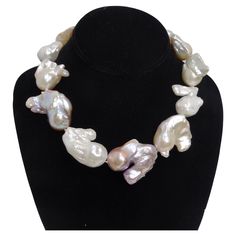 Elevate your style with the understated luxury of this classic choker-style necklace. Crafted from the most exquisite large iridescent fireball pearls, this necklace is a true testament to nature's artistry. Each pearl is a unique masterpiece, capturing and reflecting light in a mesmerizing dance of colors. Classic choker style suitable for any occasion features large iridescent fireball pearls, each one uniquely captivating. A beautiful crystal-encrusted magnetic closure adds a touch of glamour High Luster Baroque Pearl Necklace For Formal Occasions, Formal High Luster Baroque Pearl Necklace, Choker Style Necklace, Baroque Pearl Necklace, Hermes Handbags, Choker Style, John Galliano, Sparkling Crystal, Baroque Pearls