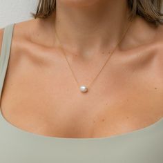 A perfect pearl moment. This delicate & dainty adjustable cable chain necklace offers a stunning freshwater pearl pendant. Ideal to stack or wear on it's own you can adjust the length depending on your stack. Measurements: 4mm pearl, 1.1mm cable chain Freshwater pearls may vary in size/shape/color Minimalist Pearl Necklace With Cable Chain For Gift, White Charm Necklace With Cable Chain, Dainty Pearl Necklace With Cable Chain As Gift, Minimalist Pearl Necklace With Adjustable Chain, Adjustable Minimalist Pearl Charm Necklace, Minimalist Pearl Charm Necklace With Adjustable Chain, Cable Chain Necklace, Pearl Drop, Pearl Pendant