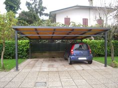 a car is parked under an attached carport