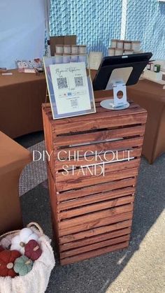 a wooden stand with some items on it and a sign that says diy checkout stand