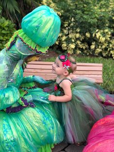 This Couture Dinosaur costume is made with several layers of four different colors of tulle and silk flowers containing army green, dark green, light blue and dark pink! The top piece, headband and tail is made with green scale dinosaur fabric. Finished with rhinestones for the center of the flowers! This beautiful costume can be worn for Halloween, birthday parties or even just for dress up! Halloween Birthday Parties, Valentines For Daughter, Baby Costumes Girl, Dinosaur Fabric, Stylish Headbands, Dinosaur Costume, Sports Headbands, Beautiful Costumes, Valentines Day Party