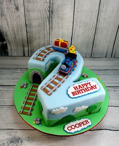 a birthday cake with a train on it