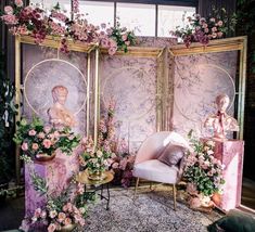 an elaborately decorated room with pink flowers and gold accents is shown in this image