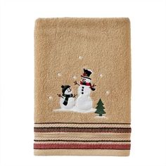 a towel with a snowman and penguin on it