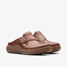 Womens Caroline Bay Tan Leather Mules | Clarks US Functional Synthetic Slip-ons With Round Toe, Comfortable Ergonomic Slip-ons With Rubber Sole, Casual Leather Slip-on Sneakers For Walking, Leather Footbed Slip-on Walking Shoes, Comfortable Slip-on Walking Shoes With Stitched Sole, Casual Slip-on Clogs With Textured Sole, Comfortable Round Toe Slip-ons For Walking, Comfortable Leather Slip-ons With Cushioned Footbed, Slip-on Sneakers With Stitched Sole And Round Toe