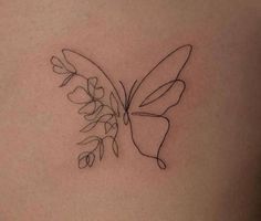 a small butterfly tattoo with flowers on it's back side ribcage tattoos