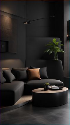 a modern living room with black walls and large round coffee table in the center area