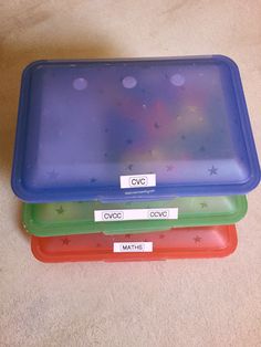 three plastic trays stacked on top of each other