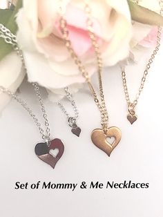 "Aren't these cut out heart necklaces too cute? This is a great Baby Shower gift idea for someone's first baby! Also, you could order the set and hang the tiny heart over the large heart while you're expecting! You can order the same finish chain as the heart or let your imagination go wild and create your own idea! Let's talk about it! Each heart comes with either a sterling silver chain or a gold filled chain in your chosen size and in newborn to 12 months (11\"). You could also add a birthsto Heart Cut Out, Kids Necklace, Gold Heart Necklace, Sell Gold, Tiny Heart, Big Heart, Pearl Chain, Birthstone Charms, Mother And Child