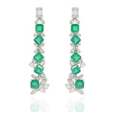 This is part of Chairish’s Fine Jewelry assortment.  Designer Emerald and Diamond Long Dangle Earrings to make a statement with your look. These earrings create a sparkling, luxurious look featuring square cut gemstone. If you love to gravitate towards unique styles, this piece of jewelry is perfect for you.  PRODUCT DETAILS :-  > Material - 14K Solid White Gold > Gemstone - Emerald  > Gemstone Weight - 7.43 ct > Gemstone Shape - Square  > Gemstone Pcs - 10  > Gemstone Size - 5 x 4 mm > Diamond Weight - 1.39 ct > Diamond size - 1.4 mm > Gross Weight - 8.115 Grams > Setting - Prong setting > Length - 50 mm  > Width - 12 mm Elegant Emerald Cut Earrings, Emerald Earring, Earrings To Make, Diamond Chandelier Earrings, Silver Chandelier Earrings, Gold Chandelier Earrings, Boho Chic Earrings, Emerald Color, Long Dangle Earrings