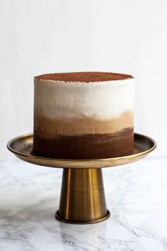 a cake sitting on top of a gold plate