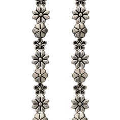 two long silver earrings with flowers on them