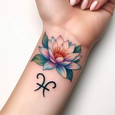 a woman's arm with a flower and piscruum tattoo on it