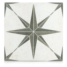 a white and gray tile with a star design