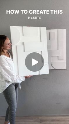 a woman holding up a large white piece of art with the words how to create this in 4 steps