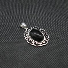 Brand new sterling silver pendant with 18x13mm black onyx - PE001454. Stamped 925. Approximate weight 7.0 grams. Dimensions 29x25mm (1.16x1.00 inches). All our jewels are made from solid sterling silver 925/1000 and are carefully crafted by hand in our family workshop. We dispatch your orders in 5 working days, worldwide and the postage is $5. We ship registered priority mail. Please allow 5-7 working days for delivery in Europe and 10-15 working days outside Europe. For any questions - please d Classic Black Oval Pendant Jewelry, Black 925 Stamped Pendant Jewelry, Black Sterling Silver Jewelry With Oval Cabochon, Black Oval Cabochon Sterling Silver Jewelry, Nickel-free Black Oval Jewelry, Elegant Black Oval Nickel-free Jewelry, Black Round Pendant Jewelry With Cabochon, Black Cabochon Round Pendant Jewelry, Black Hallmarked Round Pendant Necklace