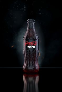 a coca cola bottle with the word zero on it's side in front of a black background