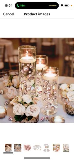 an image of candles on a table with flowers and other things in the photo below