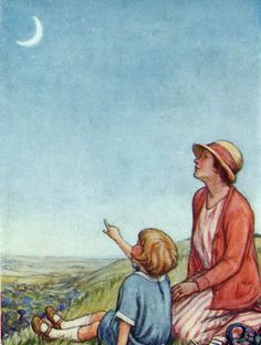 a woman and child sitting on top of a grass covered field next to a moon