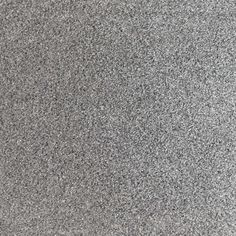 a close up view of the surface of a granite floor