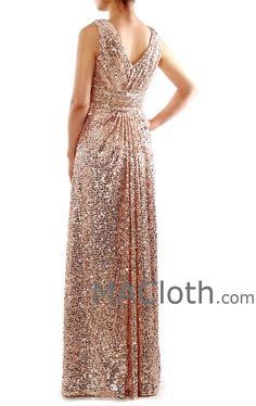 a woman in a gold sequin gown with her hands on her hips and back to the camera