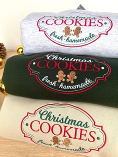 three christmas cookies towels stacked on top of each other