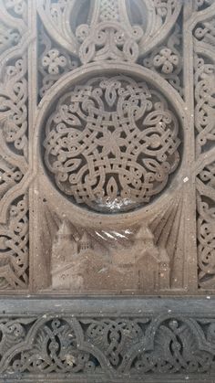 an intricate carving on the side of a building