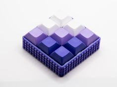 a purple and white object sitting on top of a table