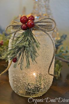 a glass jar filled with snow and berries