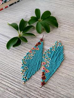 Turquoise beaded fringe earrings seed bead earrings dangle boho earrings chandelier earrings native beaded earrings colorful beaded earrings For same model smaller size ;  https://www.etsy.com/listing/1189984832 For other color of the same model; https://www.etsy.com/listing/1160713718 https://www.etsy.com/listing/1185696962 https://www.etsy.com/listing/1201751487 ♥𝑇ℎ𝑒 𝑝𝑎𝑡𝑡𝑒𝑟𝑛 𝑜𝑓 𝑡ℎ𝑖𝑠 𝑒𝑎𝑟𝑟𝑖𝑛𝑔 𝑖𝑠 𝑖𝑛𝑠𝑝𝑖𝑟𝑒𝑑 𝑏𝑦 𝑓𝑖𝑒𝑙𝑑𝑠 𝑓𝑢𝑙𝑙 𝑜𝑓 𝑓𝑙𝑜𝑤𝑒𝑟𝑠 𝑖𝑛 𝑛𝑎𝑡𝑢? Turquoise Seed Bead Earrings, Native Beaded Earrings, Handwoven Earrings, Beaded Charms, Beaded Things, Bead Earring, Bead Fringe, Beaded Fringe Earrings, Beadwork Designs